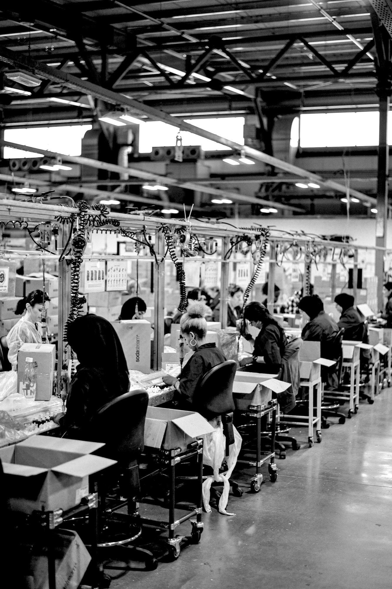 Workers on a factory assembly line