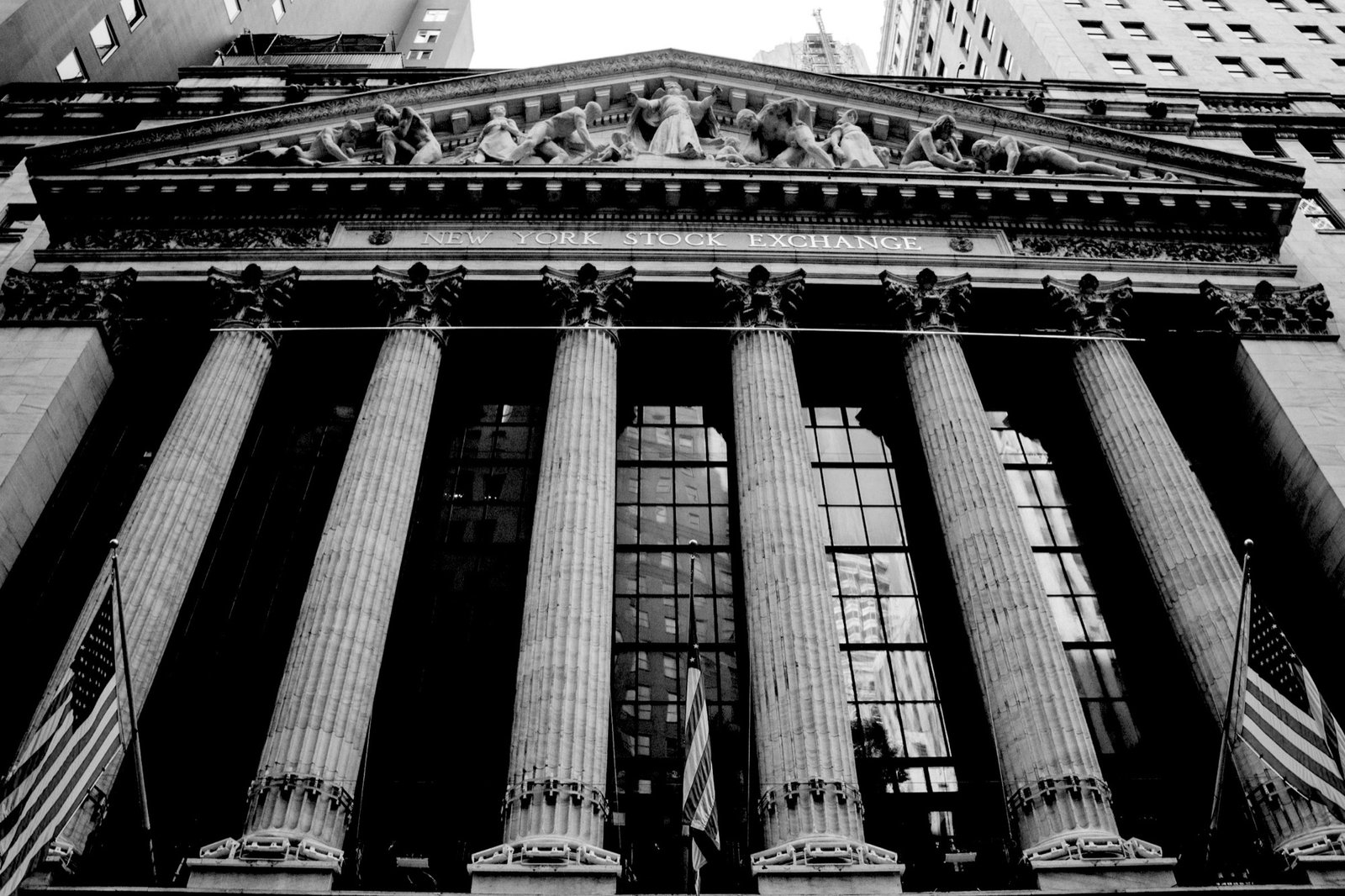 The New York Stock Exchange facade with U.S. flags